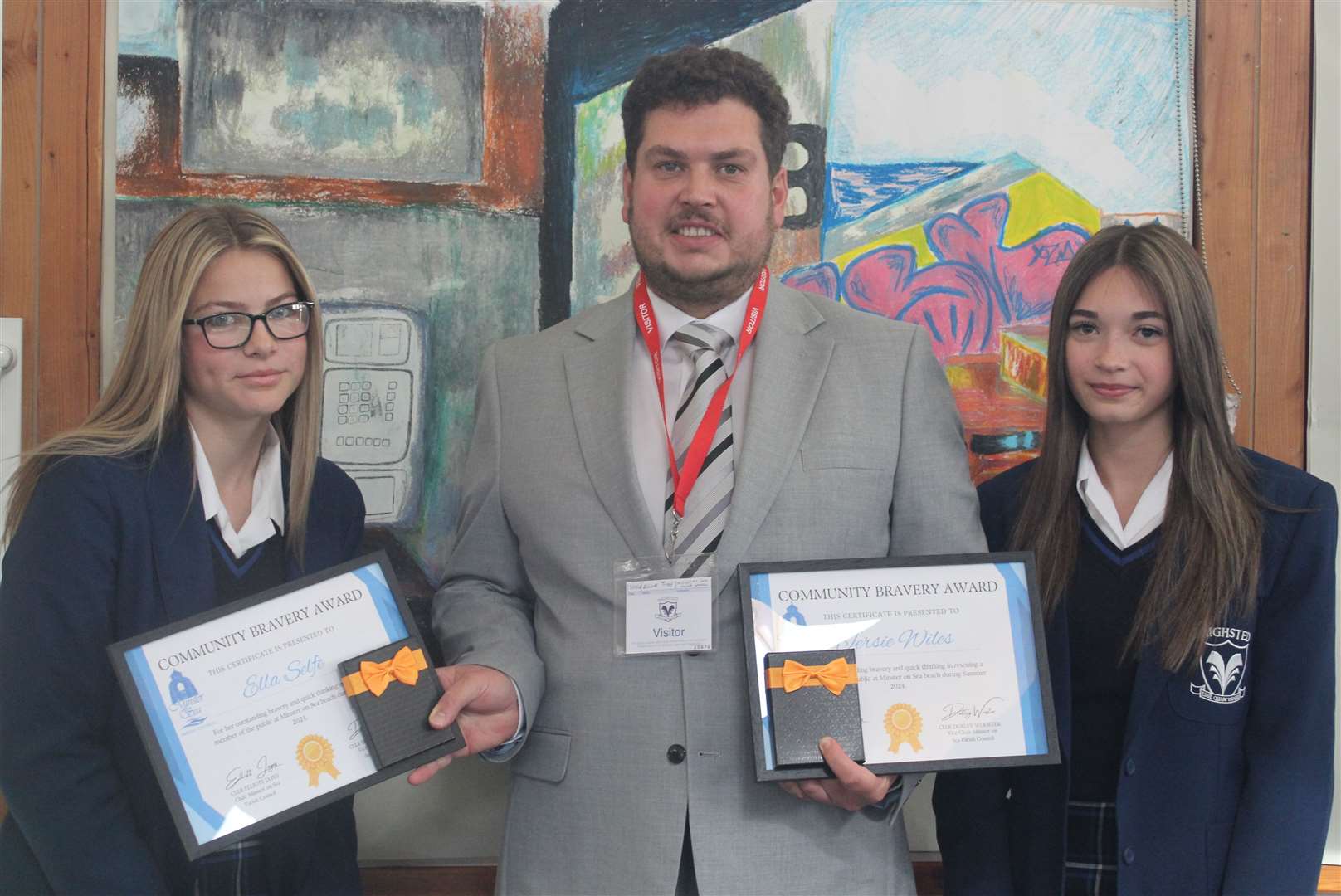 Ella Selfe and Jersie Wiles with Cllr Elliott Jayes, who gave them a bravery award. Picture: Highsted Grammar School