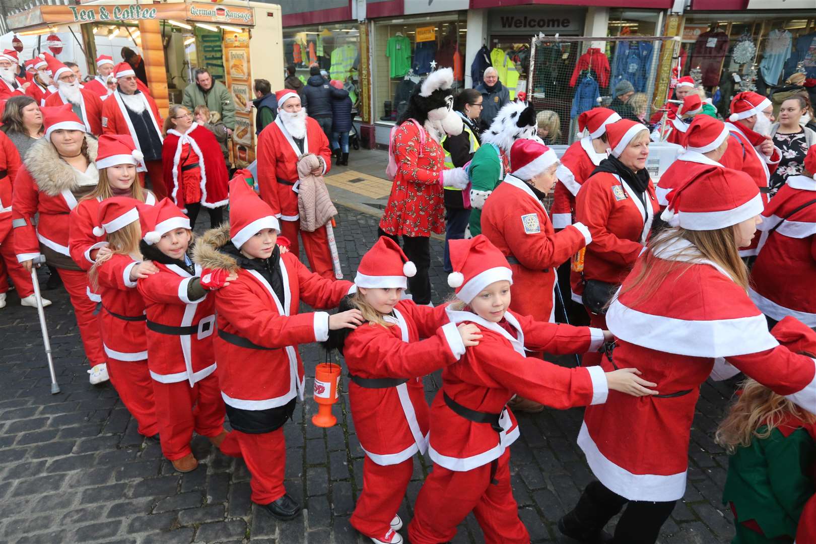 Santas saunter in a conga at the Clock Tower in Sheppey