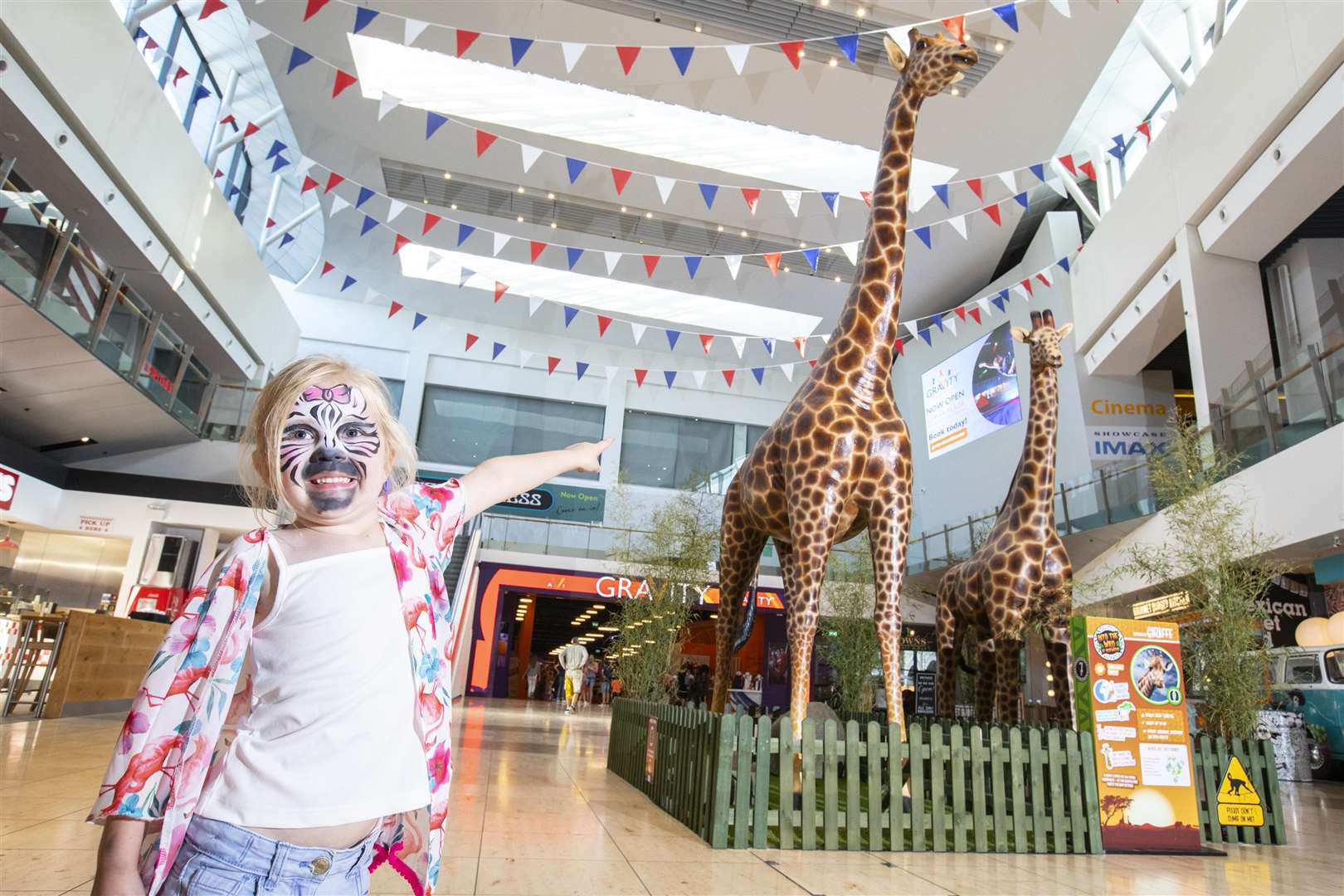 An 18ft giraffe is one of the animal attractions