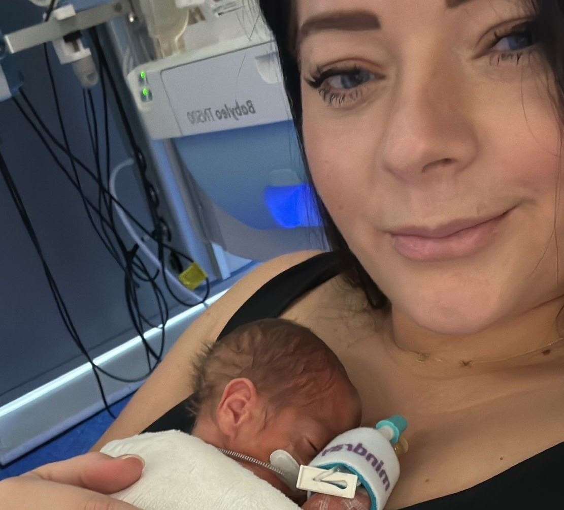 Emma enjoying a cuddle with baby Kai in the neonatal intensive care unit