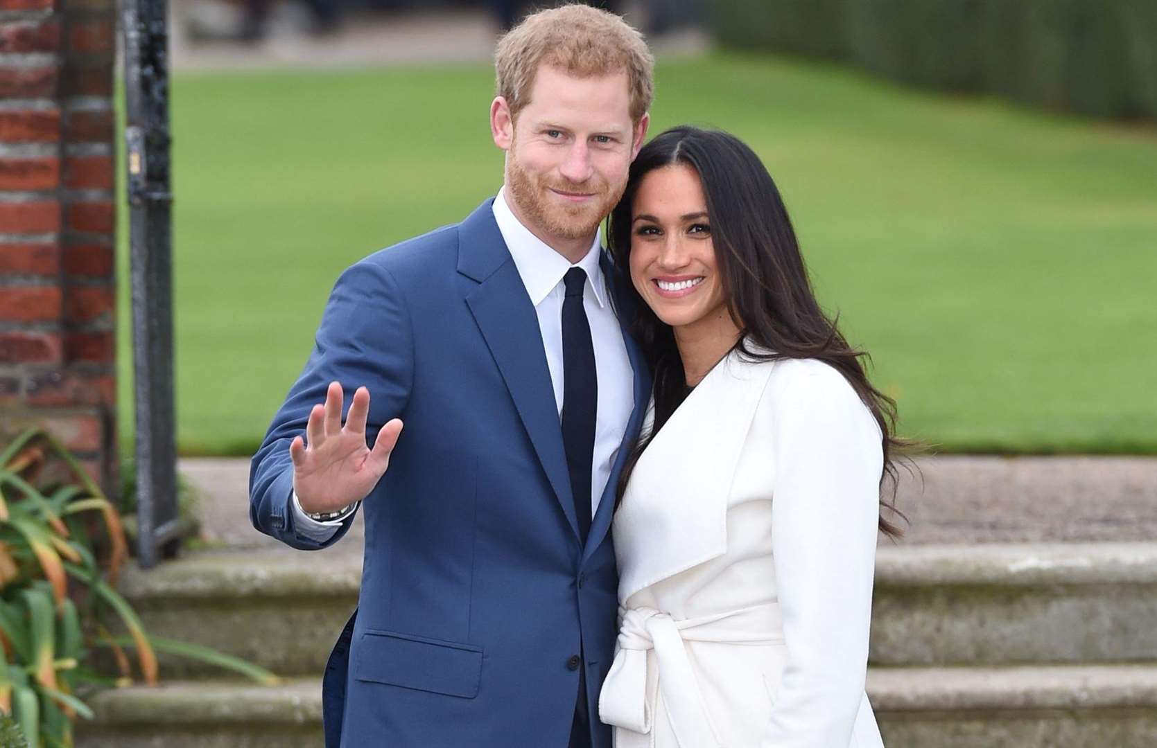 Prince Harry and Meghan Markle in the Sunken Garden at Kensington Palace, London, after the announcement of their engagement. Photo credit: Eddie Mulholland/Daily Telegraph/PA Wire.