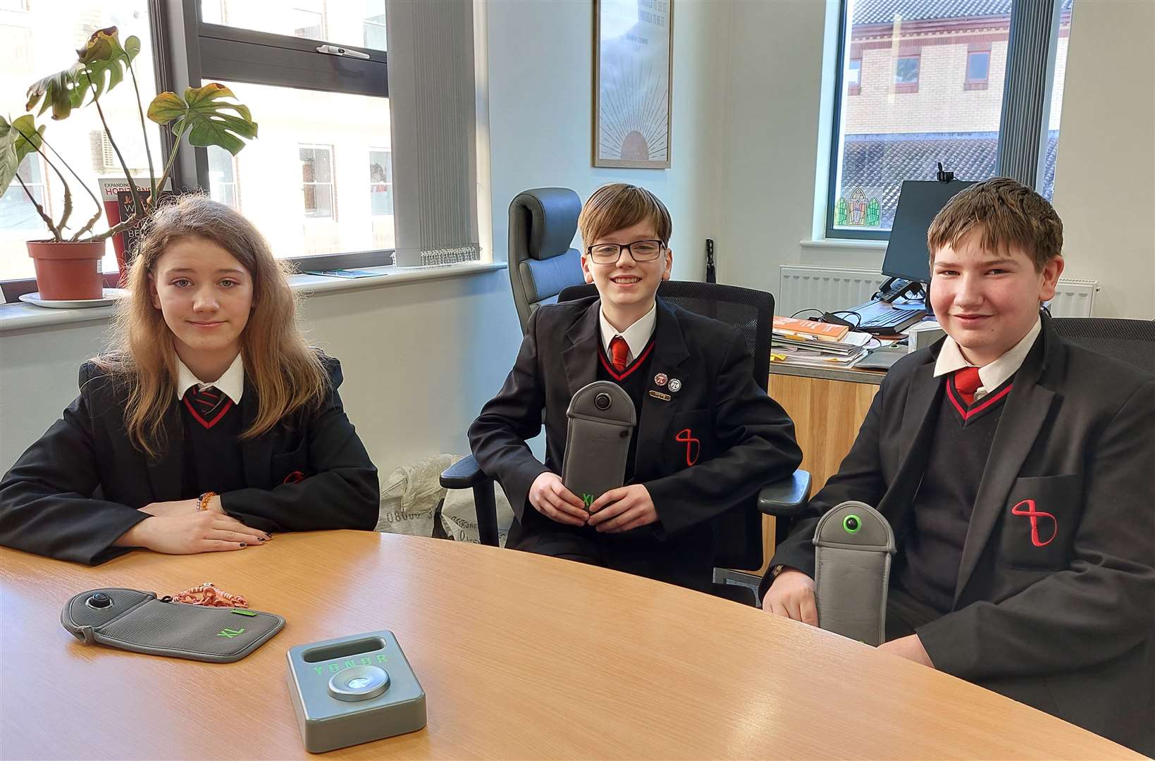 Pupils Morgan Taylor, Charlie Carr and Jack Bell with the Yondr pouches last year