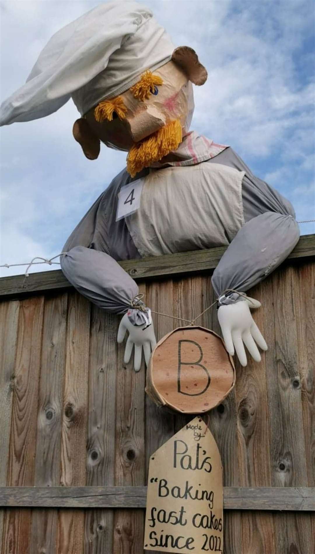 This was last year's Pat-a-cake, Pat-a-cake Baker's man. The creator doesn't have a pavement facing front garden so makes scarecrows that look over the fence into her neighbouring alley.